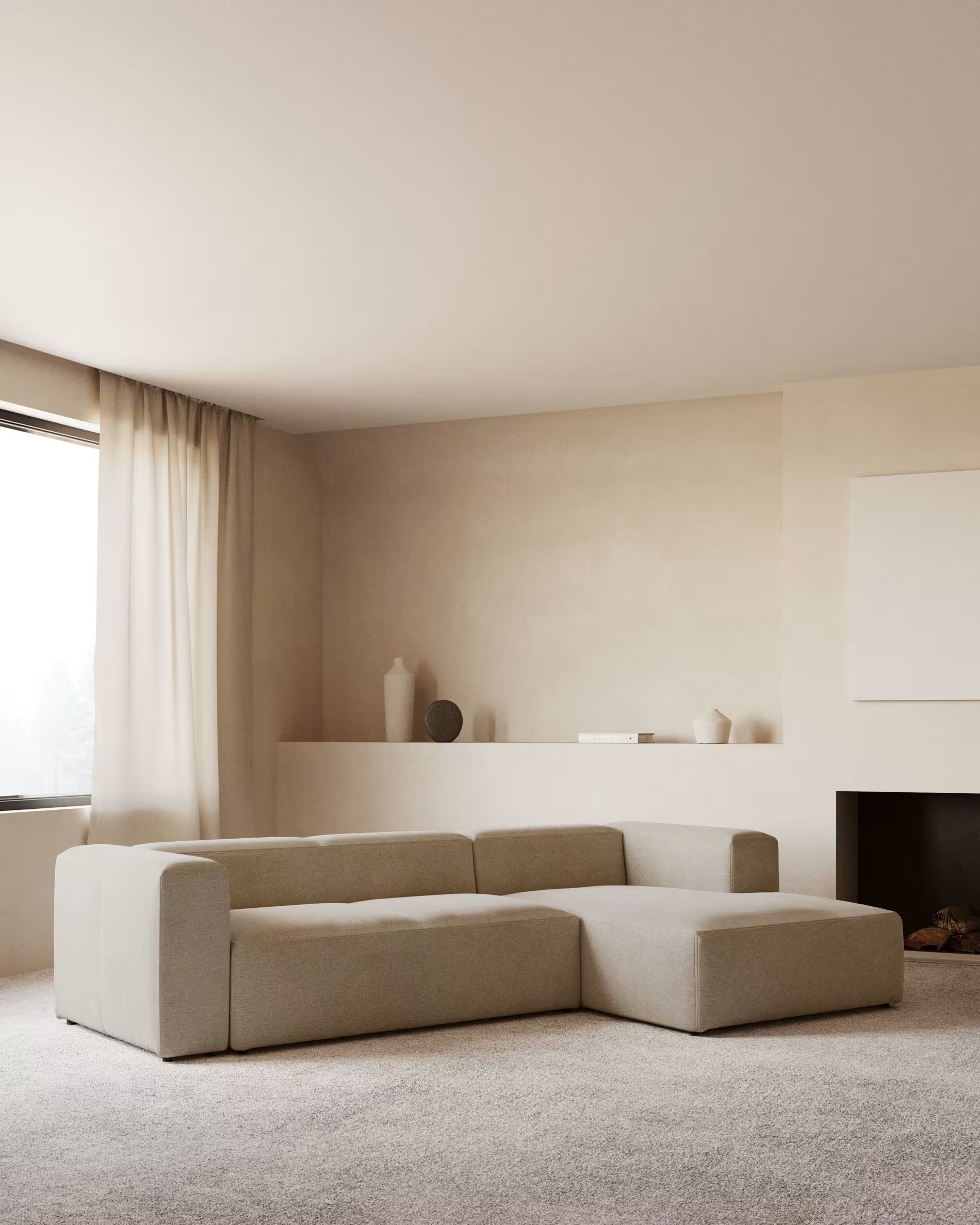 Beige sectional sofa in a minimalistic living room with neutral decor.