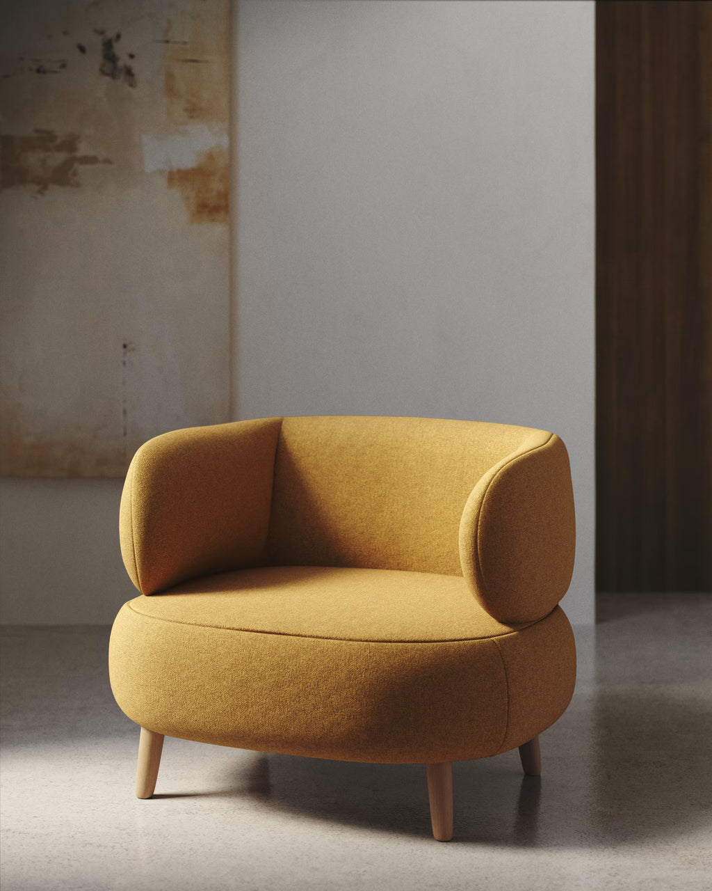 Yellow armchair in a minimalistic room with a textured wall.