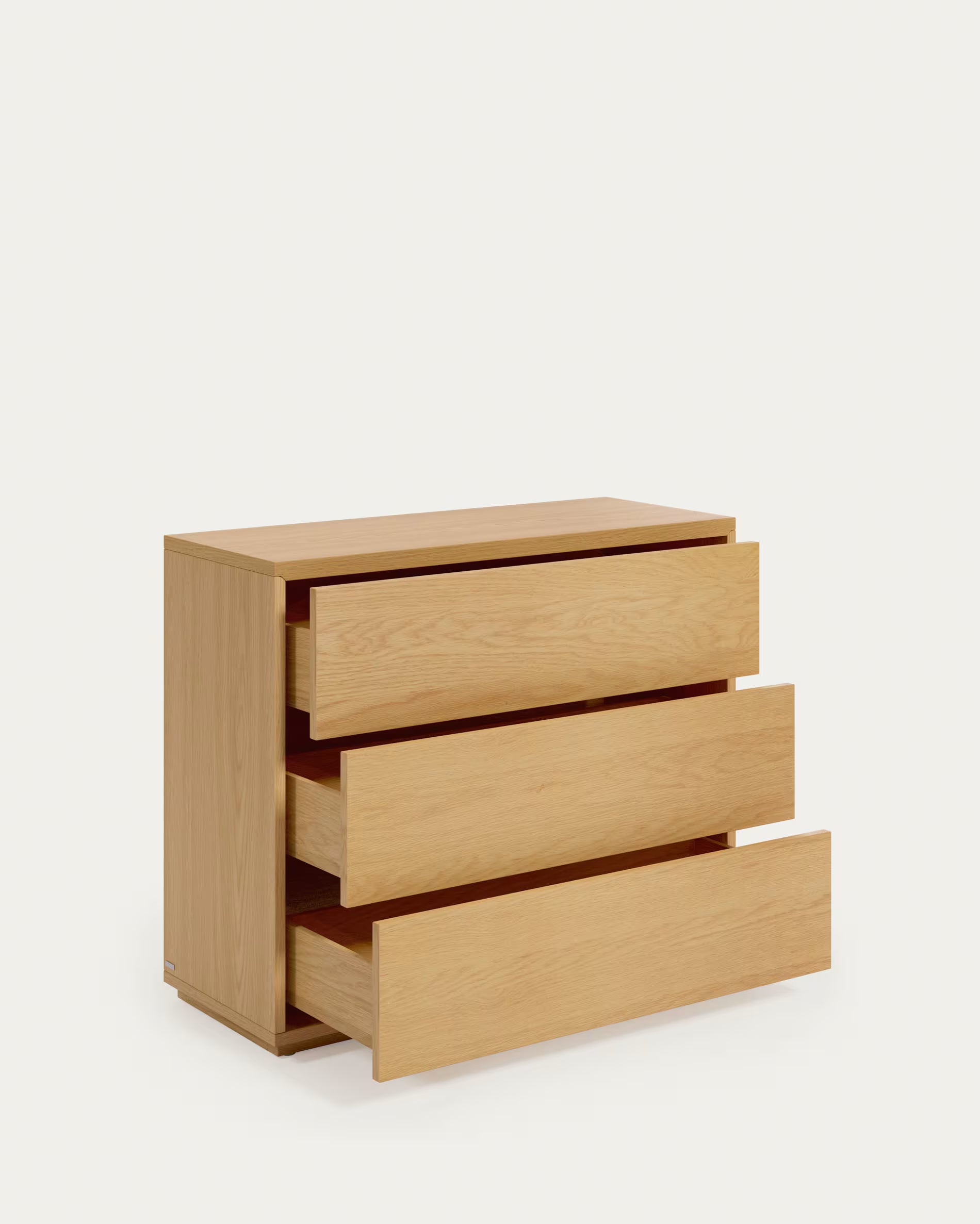 Wooden dresser with three drawers on a white background