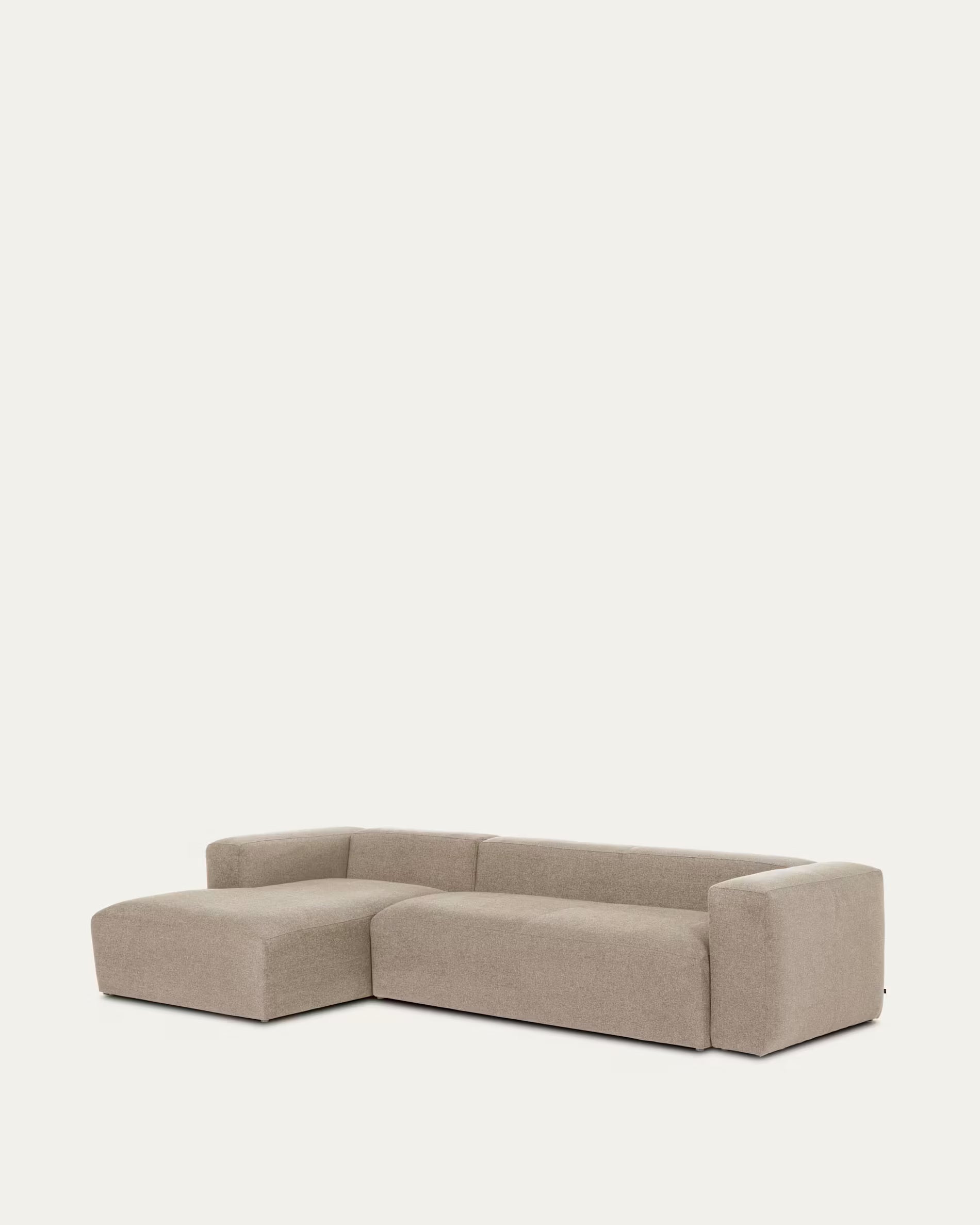 Beige sectional sofa on a light beige background