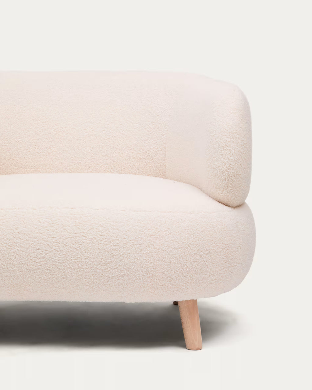 Beige sofa with wooden legs on a white background