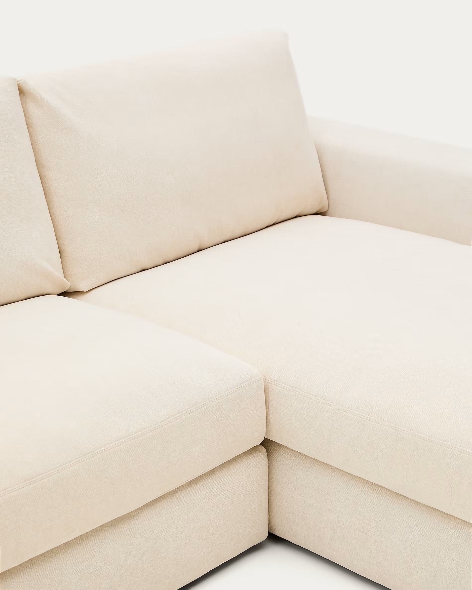 Beige sectional sofa on a white background