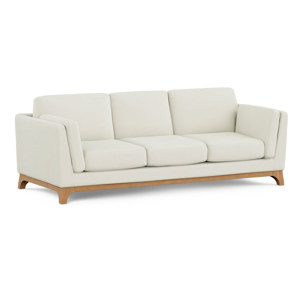 Beige sofa with wooden legs on a white background